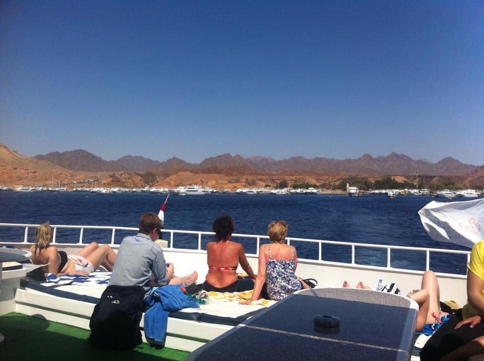 Sunbathing on the back of the scuba boat